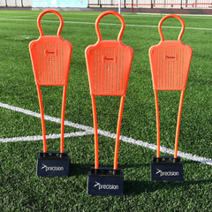 Three orange precision mini football training mannequins with black bases