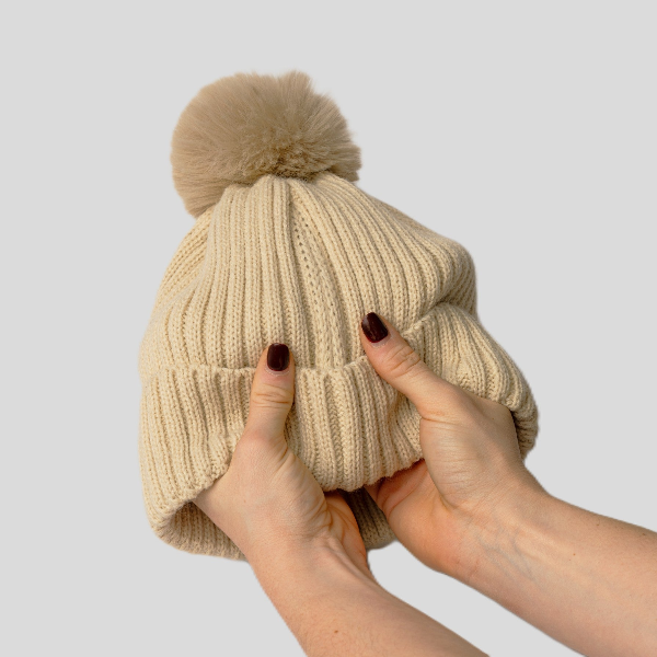 The Magni-Strip® Bobble Hat Beige held up