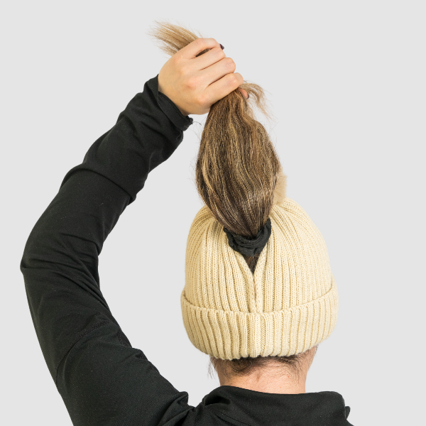 Person wearing Magni-Strip® Bobble Hats holding hair
