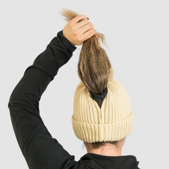 Person wearing Magni-Strip® Bobble Hats holding hair