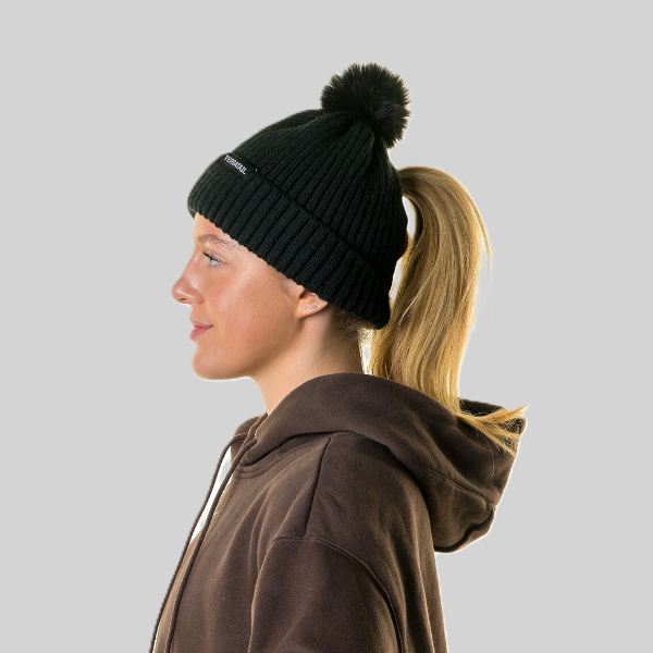 Person wearing Magni-Strip® Bobble Hat Black worn by woman outdoors and brown hoodie