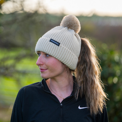 Woman wearing Magni-Strip® Bobble Hat Beige outdoors