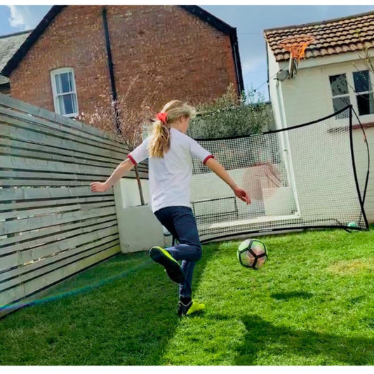 Girl Football in small garden