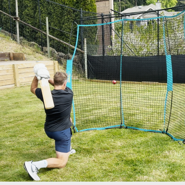 Man batting into cricket backfire net