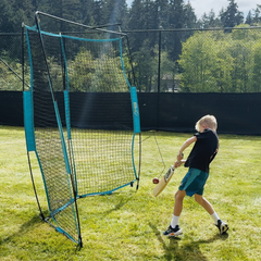 Boy batting into cricket backfire net