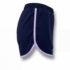 Maiden Cricket Fine Leg shorts in navy blue with purple trim and curved hem. 