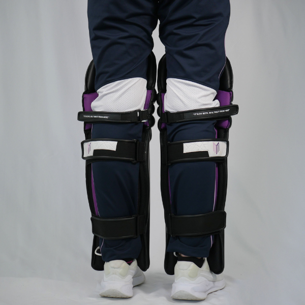 Maiden blue cricket pads on legs pictured from behind