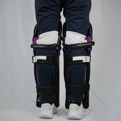 Maiden blue cricket pads on legs pictured from behind