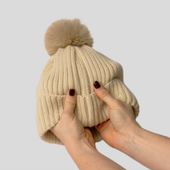 The Magni-Strip® Bobble Hat Beige held up