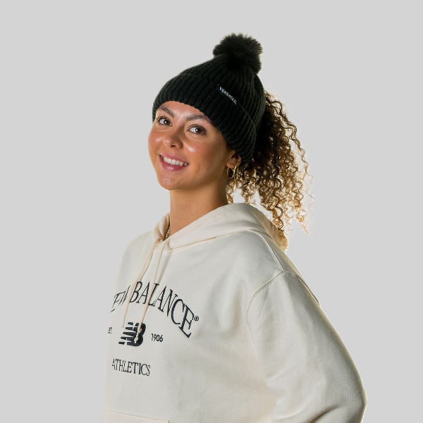 Woman wearing The Magni-Strip® Bobble Hat Black