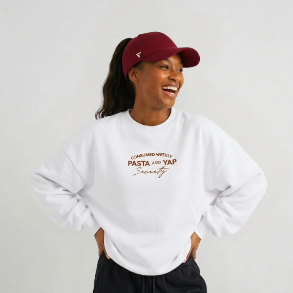Woman in white jumper wearing Versatail Berry Red cap 